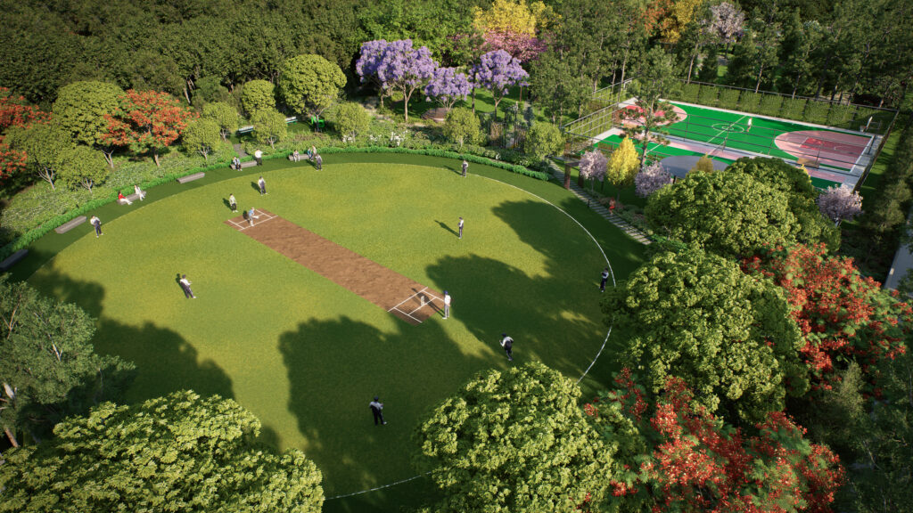 Cricket ground and multi-sports court surrounded by lush greenery at Codename Forest View